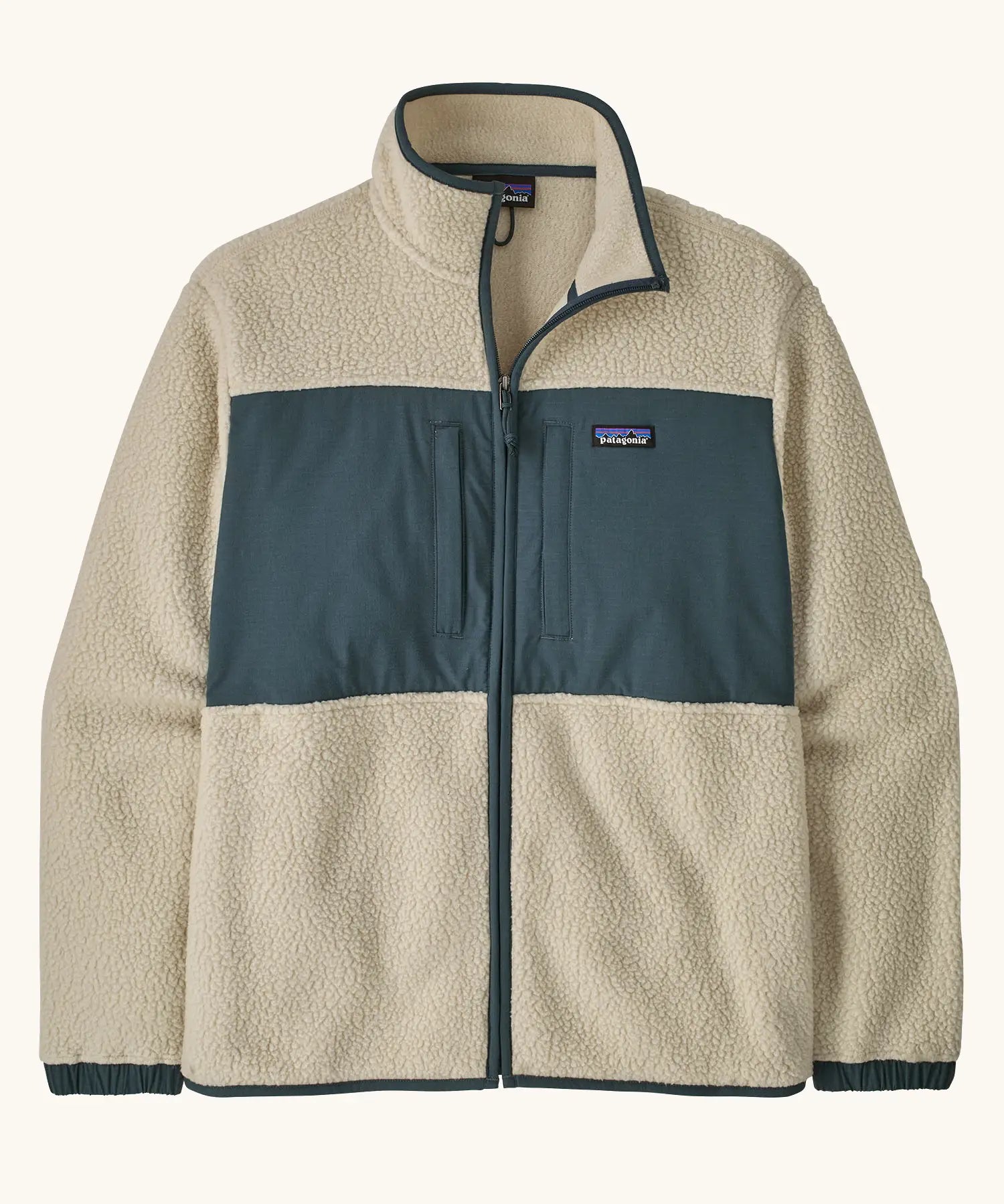Patagonia men's retro pile patch jacket in beige with a navy trim and chest panel. Features chest pockets and elasticated cuffs