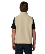 Back of man wearing Patagonia men's retro pile vest in beige with a navy trim. Gilet has a relaxed fit