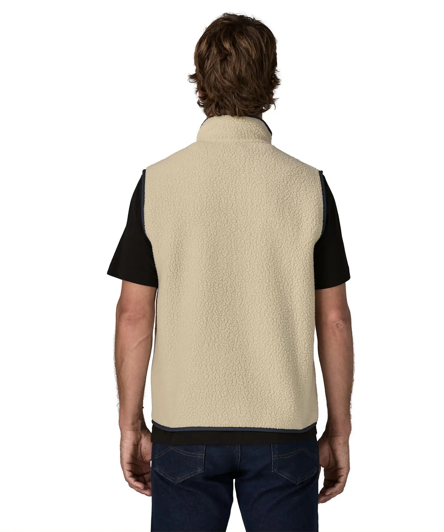 Back of man wearing Patagonia men's retro pile vest in beige with a navy trim. Gilet has a relaxed fit