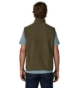 Back of man wearing Patagonia men's retro pile vest in dark green with a grey trim. Gilet has a relaxed fit