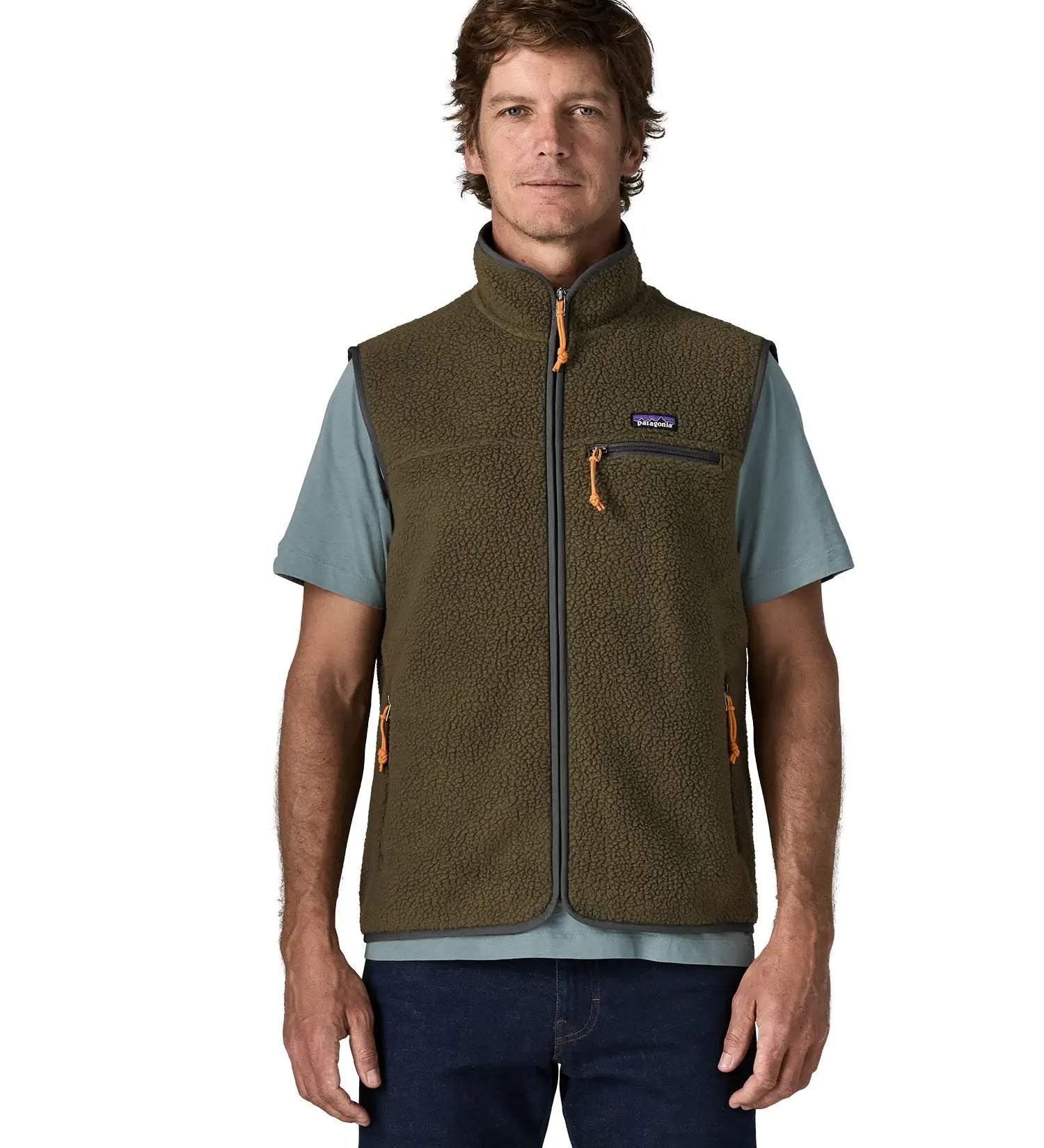 Man wearing Patagonia men's retro pile vest in dark green with a grey trim. Showing front zip fastened. Gilet has a regular fit