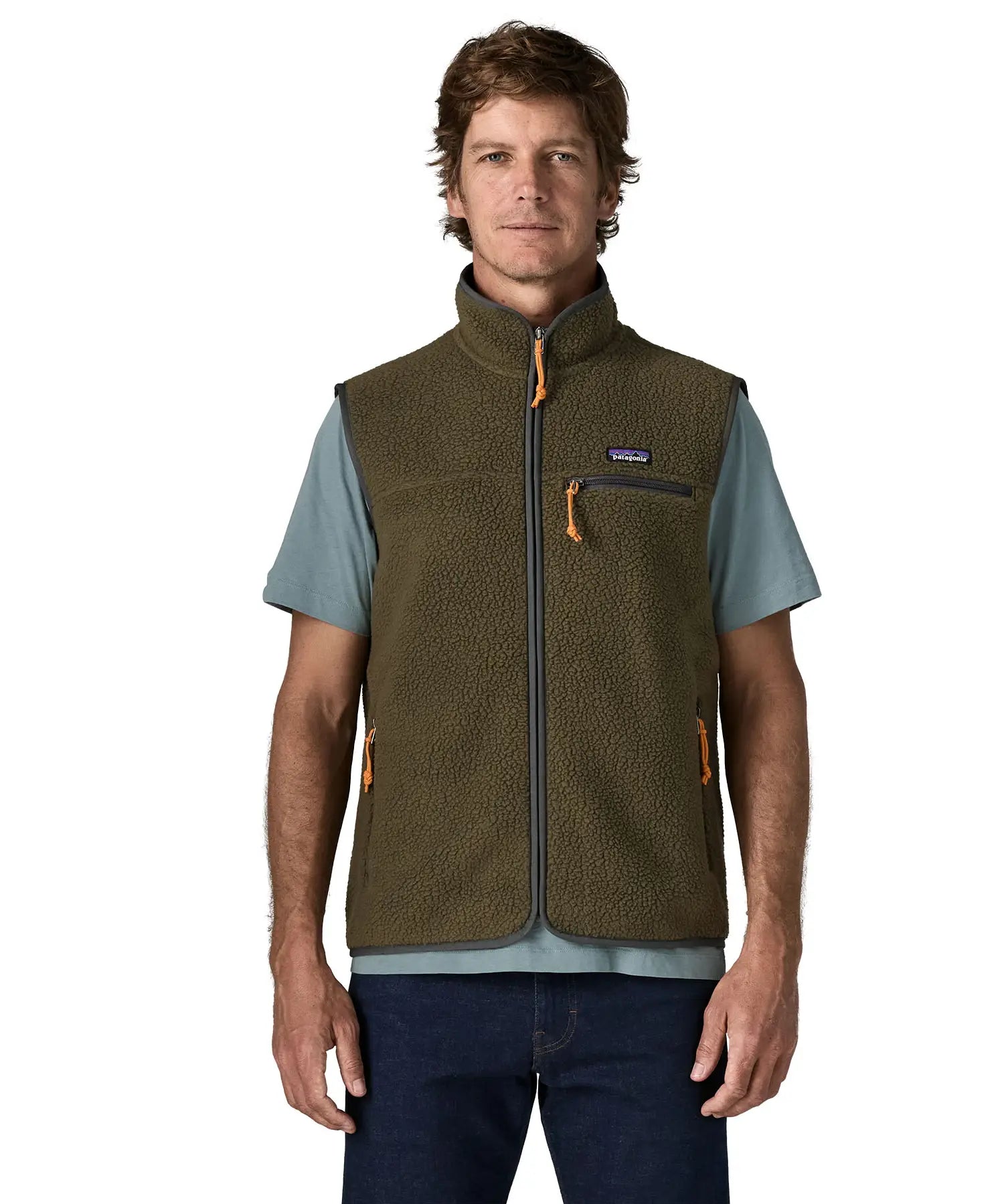 Man wearing Patagonia men's retro pile vest in dark green with a grey trim. Showing front zip fastened. Gilet has a regular fit