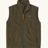 Patagonia men's retro pile vest in dark green with grey trim. A warm fleece gilet with a front zip, chest and side pockets