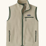 Patagonia men's retro pile vest in beige with a green trim. A warm fleece gilet with a front zip, chest and side pockets