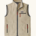 Patagonia men's retro pile fleece vest in beige with a dark blue trim. Features a full front zip, chest and side pockets