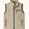 Patagonia men's retro pile fleece vest in beige with a dark blue trim. Features a full front zip, chest and side pockets