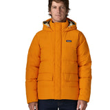Man wearing Patagonia lightweight water repellent sisar thick down jacket in orange showing togs on adjustable hood