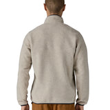 Back of man wearing Patagonia's recycled polyester synchilla snap t fleece in light grey. Fleece has a relaxed fit 