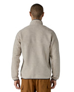 Back of man wearing Patagonia's recycled polyester synchilla snap t fleece in light grey. Fleece has a relaxed fit 