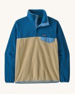Patagonia men's recycled synchilla snap t fleece in light brown with blue arms. Shows a 1/4 length front popper up to the collar and a chest pocket