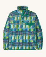 Patagonia men's recycled synchilla snap t fleece in blue and green abstract pattern design. Shows a 1/4 length front popper up to the collar and a chest pocket