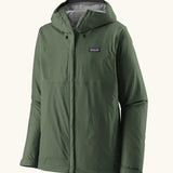 Patagonia men's waterproof torrentshell 3 layer rain hooded jacket in canopy green. Features a adjustable hood full front zip and side pockets