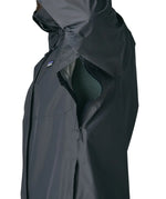 Side of man wearing the Patagonia men's torrentshell 3 layer rain jacket in smolder blue. Showing close up of the armpit zip detail for ventilation