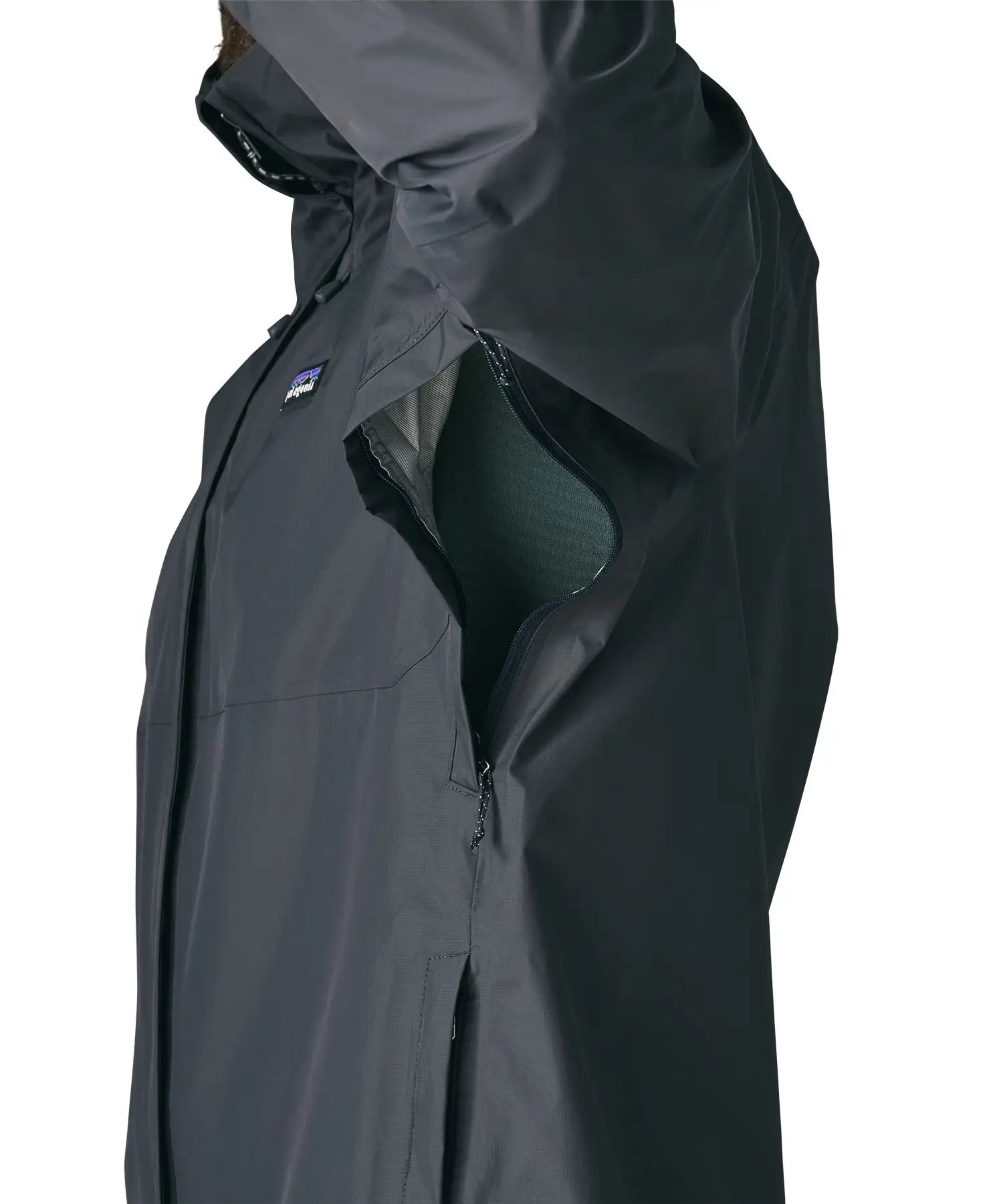Side of man wearing the Patagonia men's torrentshell 3 layer rain jacket in smolder blue. Showing close up of the armpit zip detail for ventilation