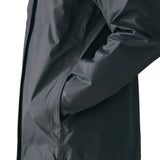 Side of man wearing the Patagonia men's torrentshell 3 layer rain jacket in smolder blue. Showing close up hand in the handwarmer pocket