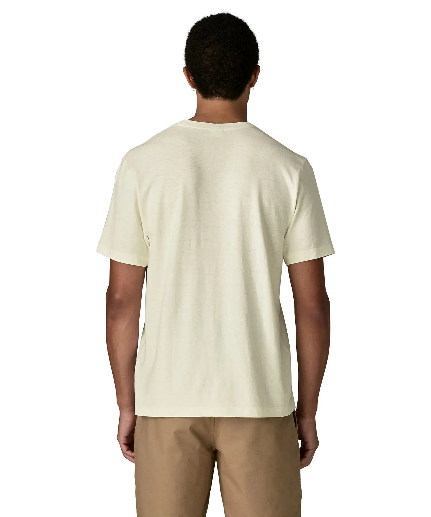Back of man wearing Patagonia's men's trail harbour short sleeve tee in cream. T-shirt has a relaxed fit and sits at the hips