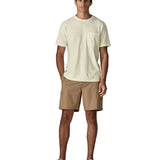 Man wearing Man wearing Patagonia's men's trail harbour short sleeve tee in cream with pouch pocket