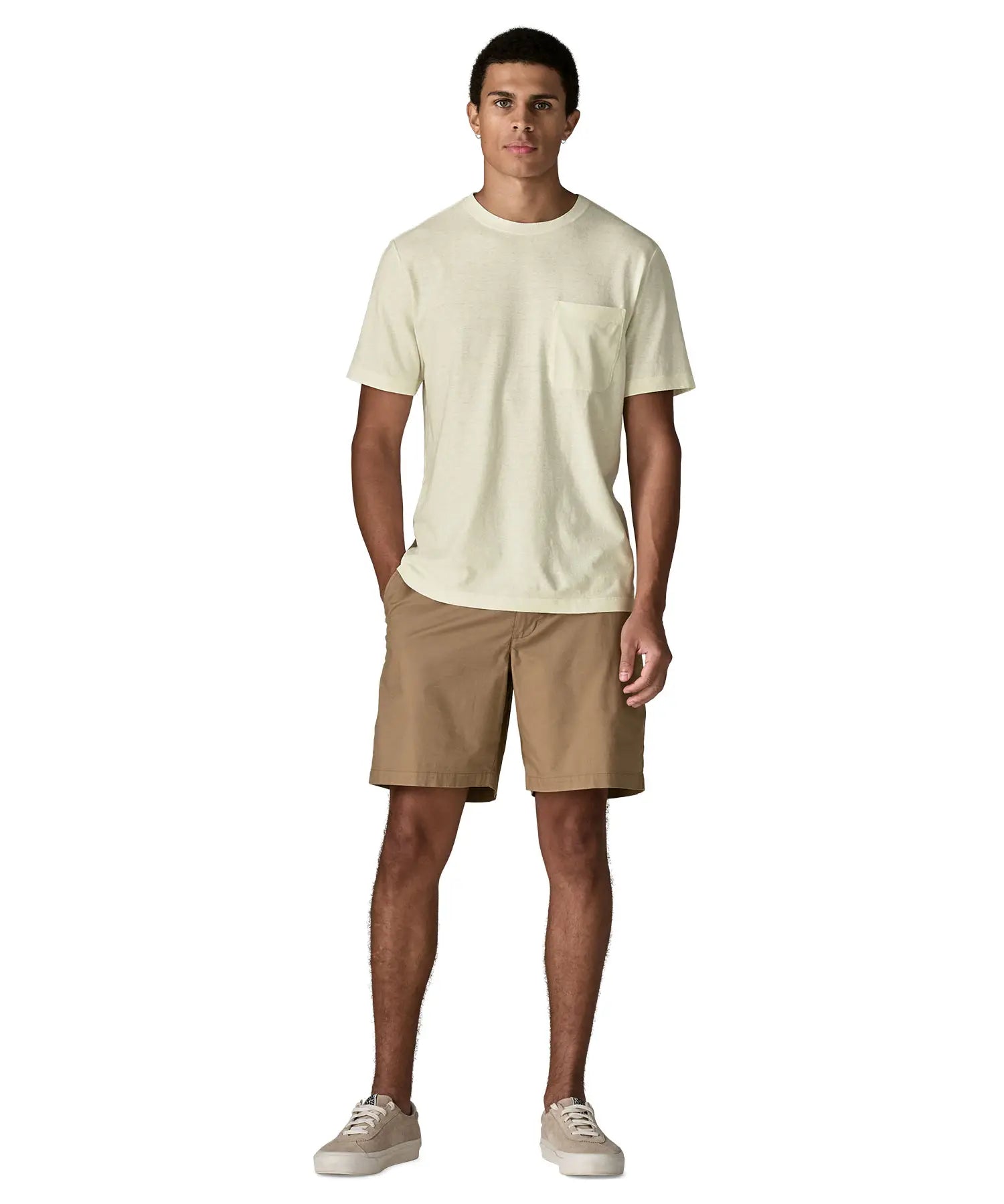 Man wearing Man wearing Patagonia's men's trail harbour short sleeve tee in cream with pouch pocket