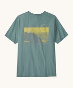 Patagonia men's water people spotter short sleeve t-shirt in sage blue with yellow cliff graphic on upper back.