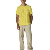 Man wearing Patagonia men's water people spotter short sleeve t-shirt in yellow. T-shirt has a relaxed fit 