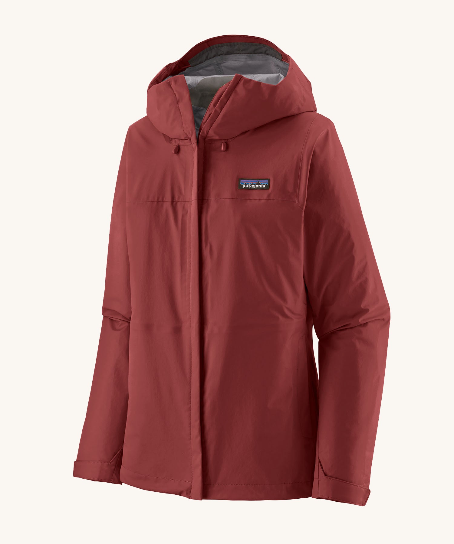 Patagonia Women's Torrentshell 3L Rain Jacket - Oxide Red zipped up the front, on a cream background.