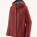 Patagonia Women's Torrentshell 3L Rain Jacket - Oxide Red zipped up the front, on a cream background.