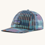 Patagonia p6 label trad cap with a blue abstract check pattern design. Shows air holes on the top and brand patch on the front