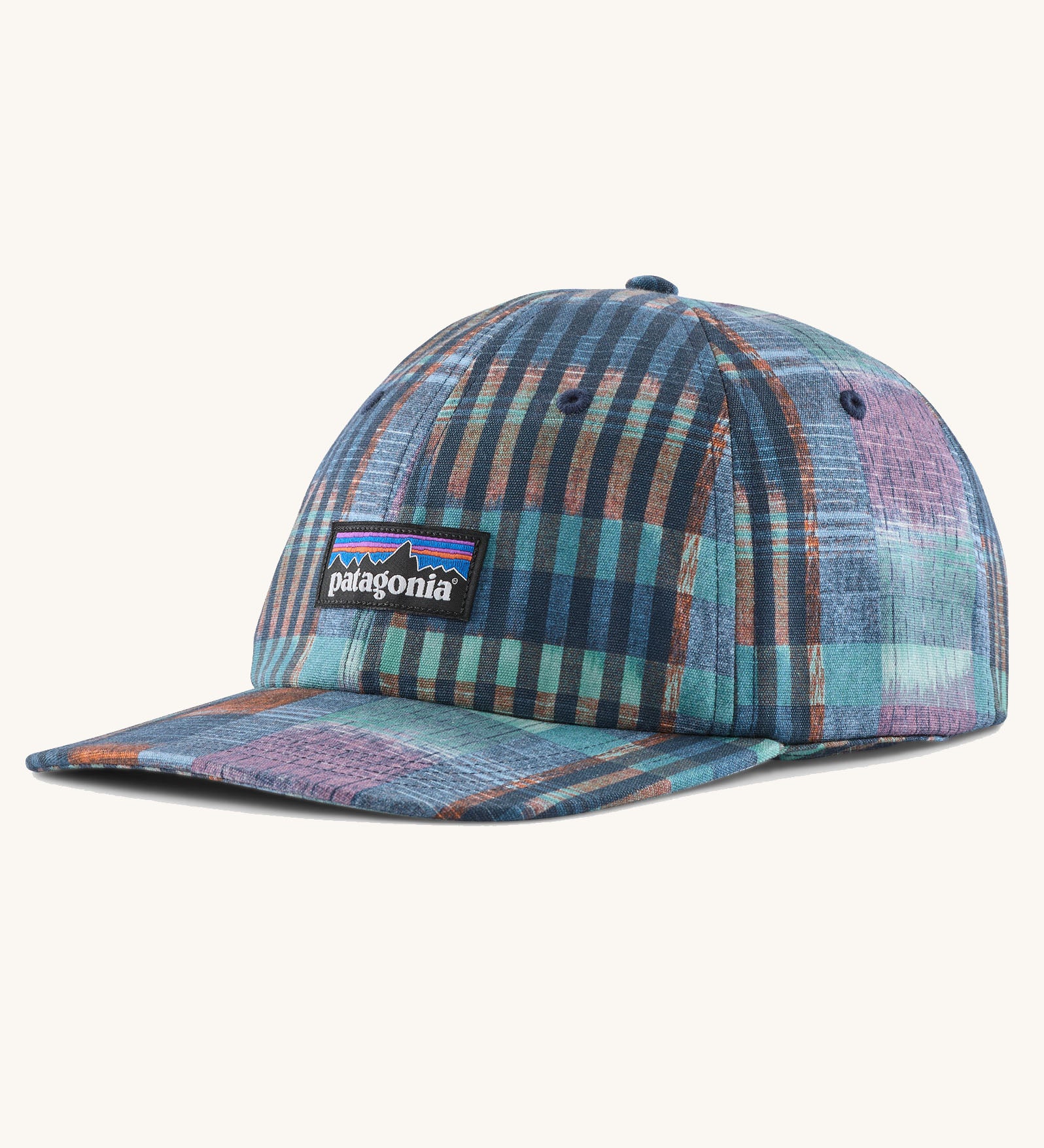 Patagonia p6 label trad cap with a blue abstract check pattern design. Shows air holes on the top and brand patch on the front