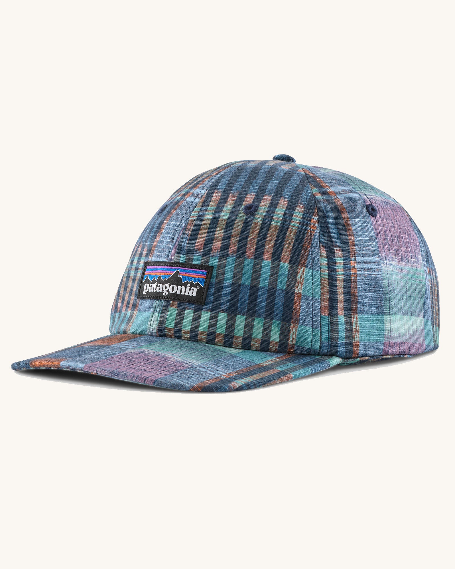 Patagonia p6 label trad cap with a blue abstract check pattern design. Shows air holes on the top and brand patch on the front