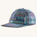 Patagonia p6 label trad cap with a blue abstract check pattern design. Shows air holes on the top and brand patch on the front