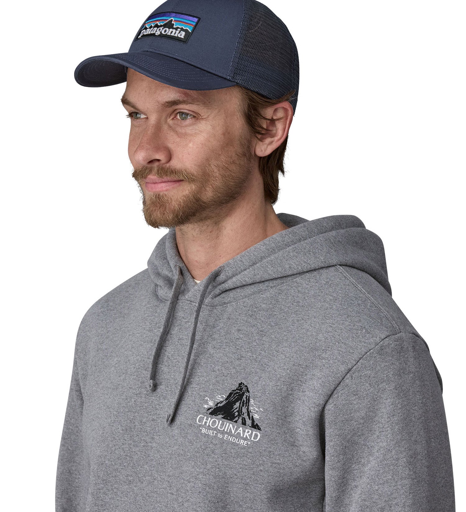 Man wearing Patagonia's p6 logo lopro trucker hat in navy, shows the breathable mesh back panel.
