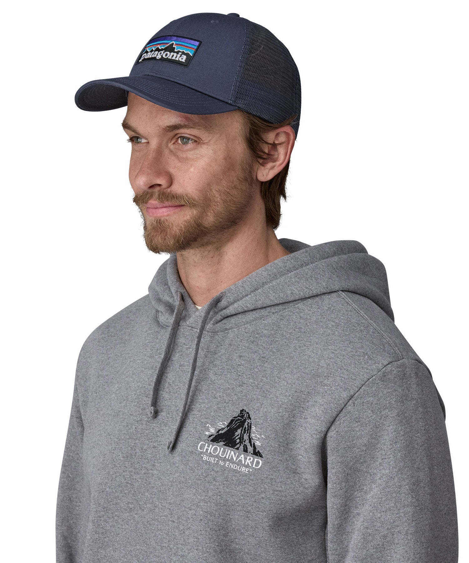 Man wearing Patagonia's p6 logo lopro trucker hat in navy, shows the breathable mesh back panel.