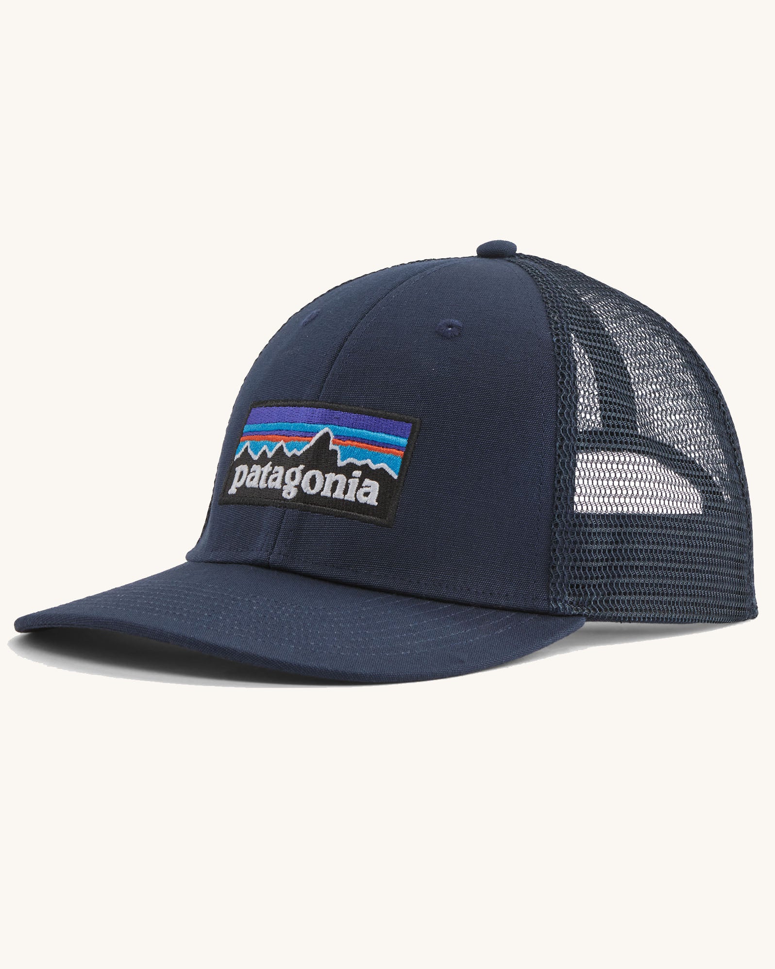 Patagonia p6 logo lopro trucker hat in navy with a breathable mesh back panel and logo patch on the front.