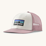 Patagonia p6 logo trucker hat in white with a pink breathable mesh back panel and visor
