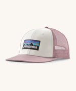 Patagonia p6 logo trucker hat in white with a pink breathable mesh back panel and visor