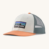 Patagonia p6 logo lopro trucker hat in white with a breathable blue mesh back panel and orange bill