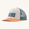 Patagonia p6 logo lopro trucker hat in white with a breathable blue mesh back panel and orange bill