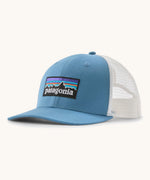 Patagonia p6 logo trucker hat in light blue with a white breathable mesh back panel