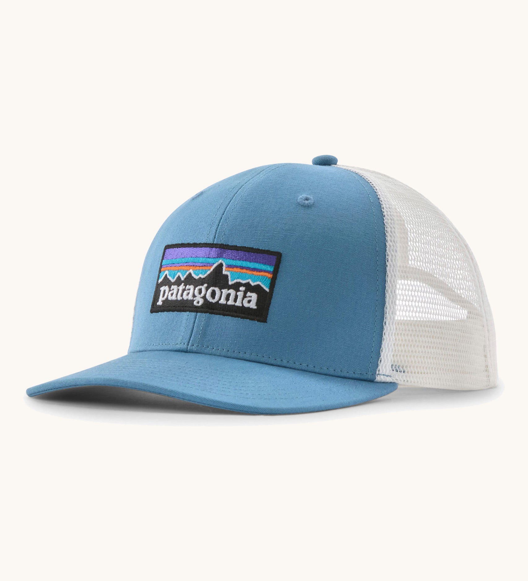 Patagonia p6 logo trucker hat in light blue with a white breathable mesh back panel