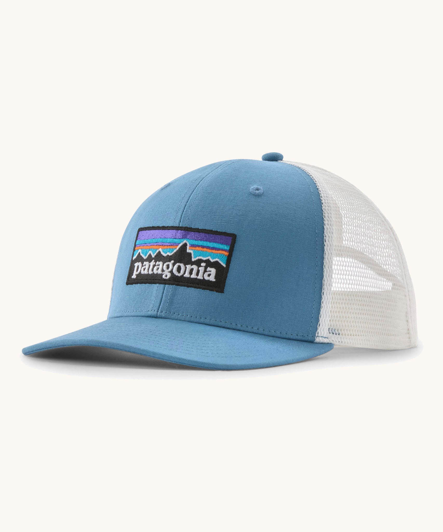 Patagonia p6 logo trucker hat in light blue with a white breathable mesh back panel
