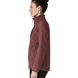 A side image of a woman wearing the Patagonia R2 crossstrata technical jacket in dark ruby available at Babipur