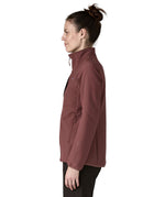 A side image of a woman wearing the Patagonia R2 crossstrata technical jacket in dark ruby available at Babipur