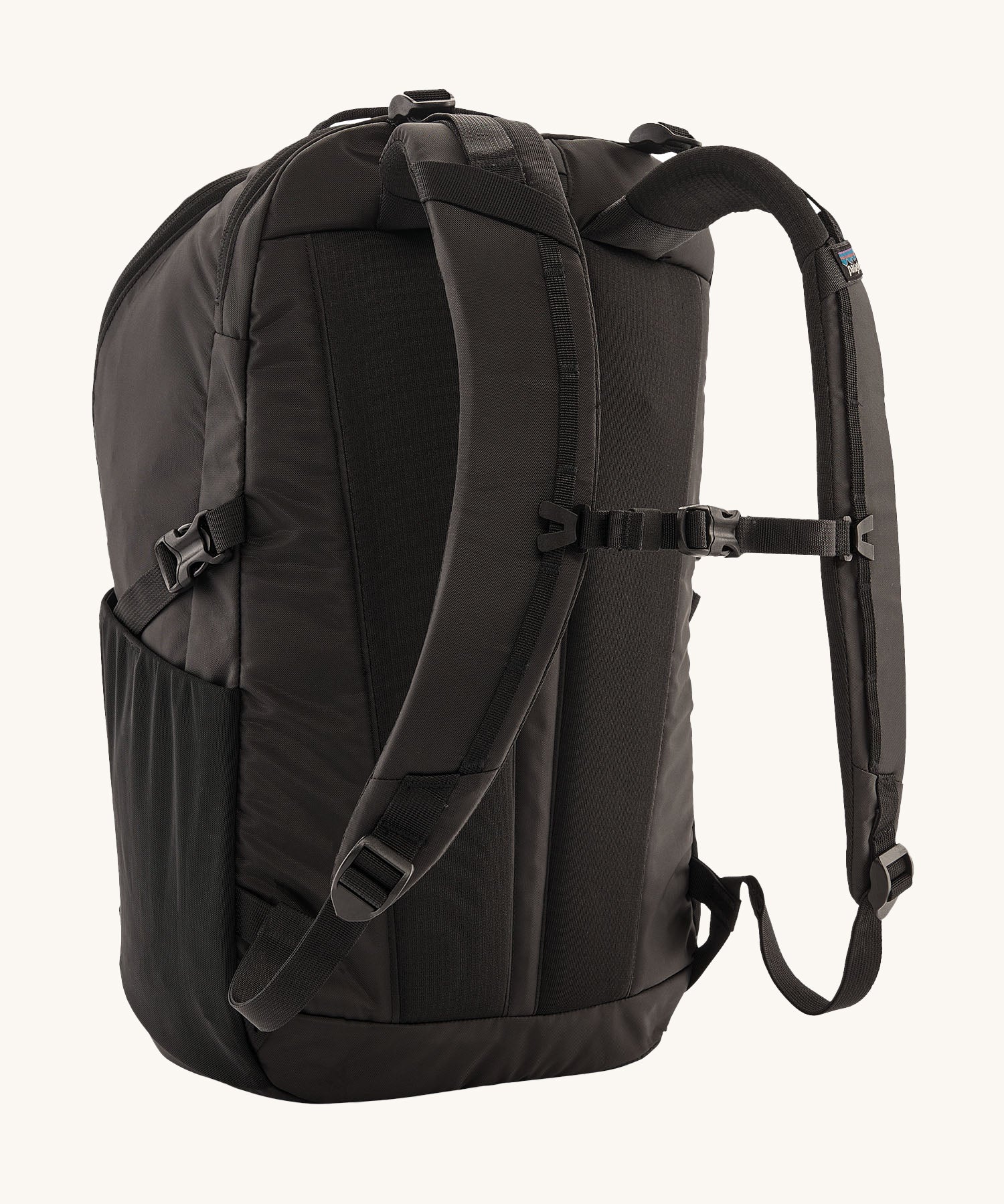 The back of the Patagonia Refugio Day Pack 30L Black, showing the shoulder straps and chest strap