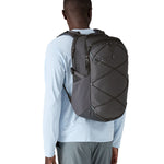 A person wearing the Patagonia Refugio Day Pack 30L  Smolder Blue, showing the front of the bag