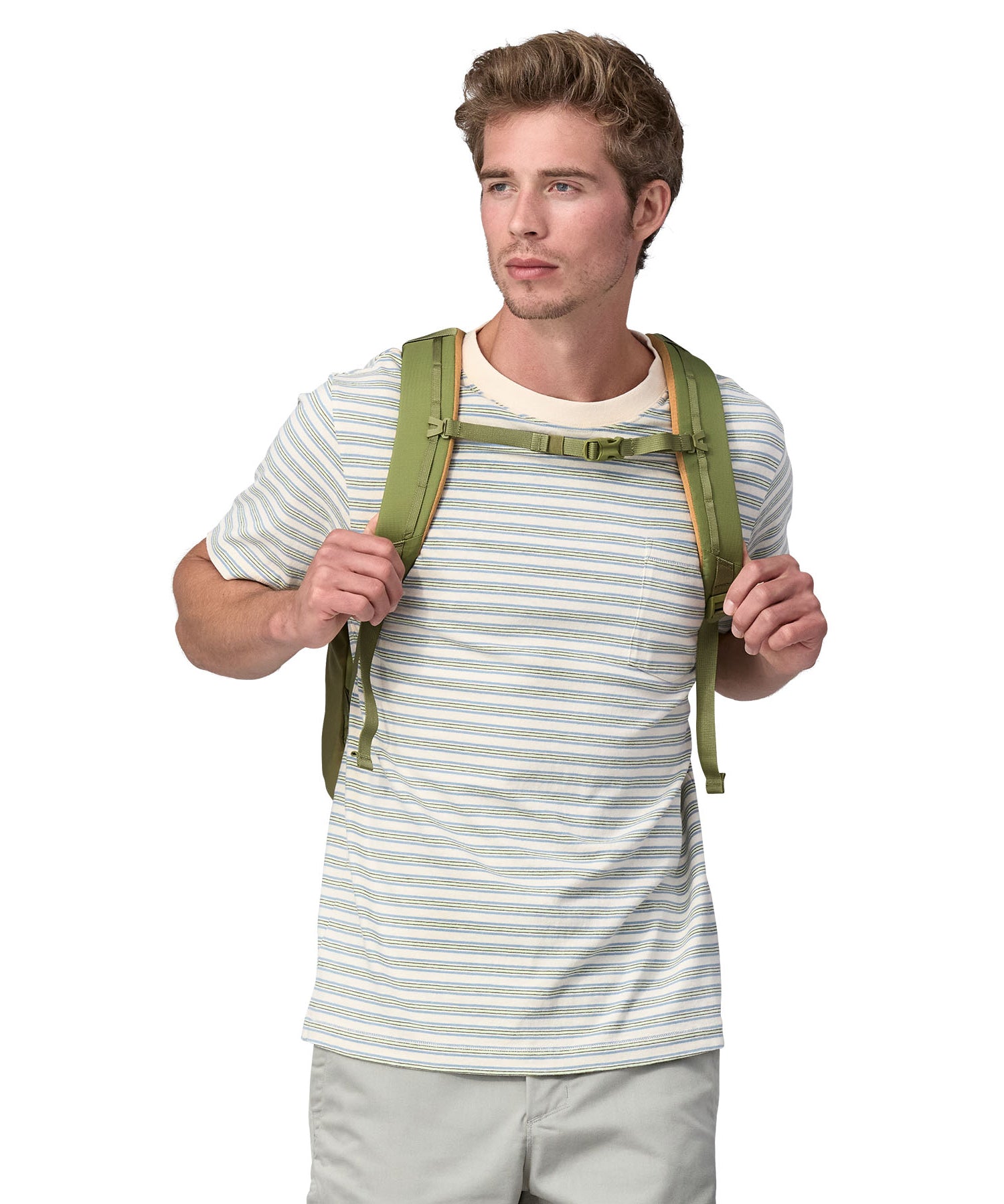 A person wearing the Patagonia Refugio Day Pack 26L, showing the chest straps