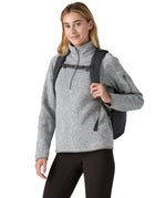 A person wearing the Patagonia Refugio Day Pack 26L Smolder Blue