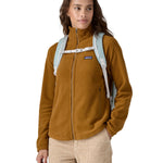 A person wearing the Patagonia Atom Tote Pack 20L Crisp Grey, showing the shoulder straps and chest clip