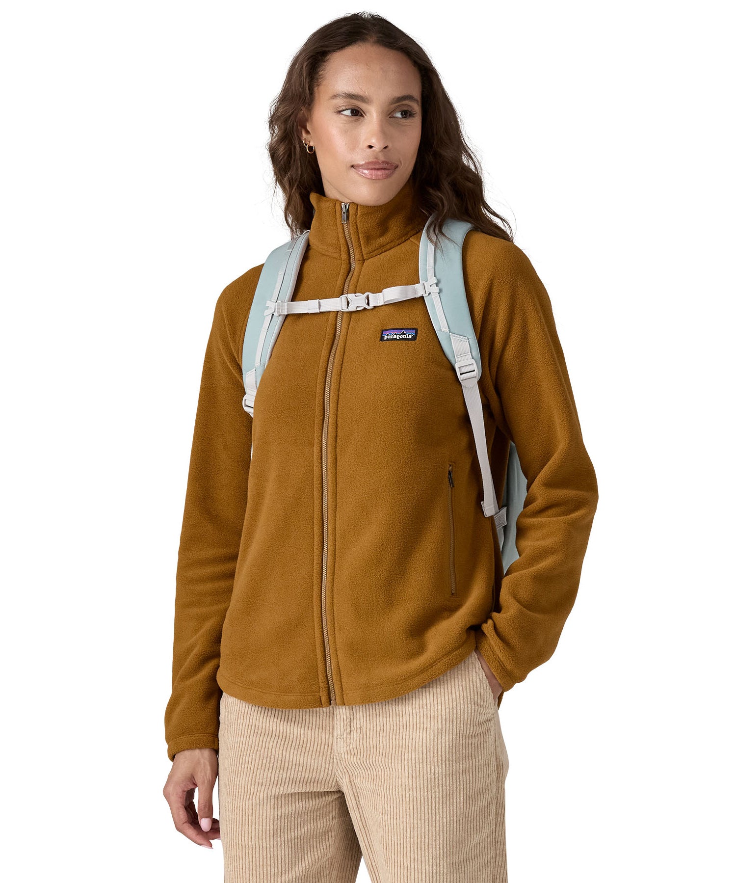 A person wearing the Patagonia Atom Tote Pack 20L Crisp Grey, showing the shoulder straps and chest clip