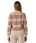The back of a woman wearing the Patagonia Women's Recycled Wool-Blend Crewneck Sweater - Starlight / Dark Natural available at Babipur.