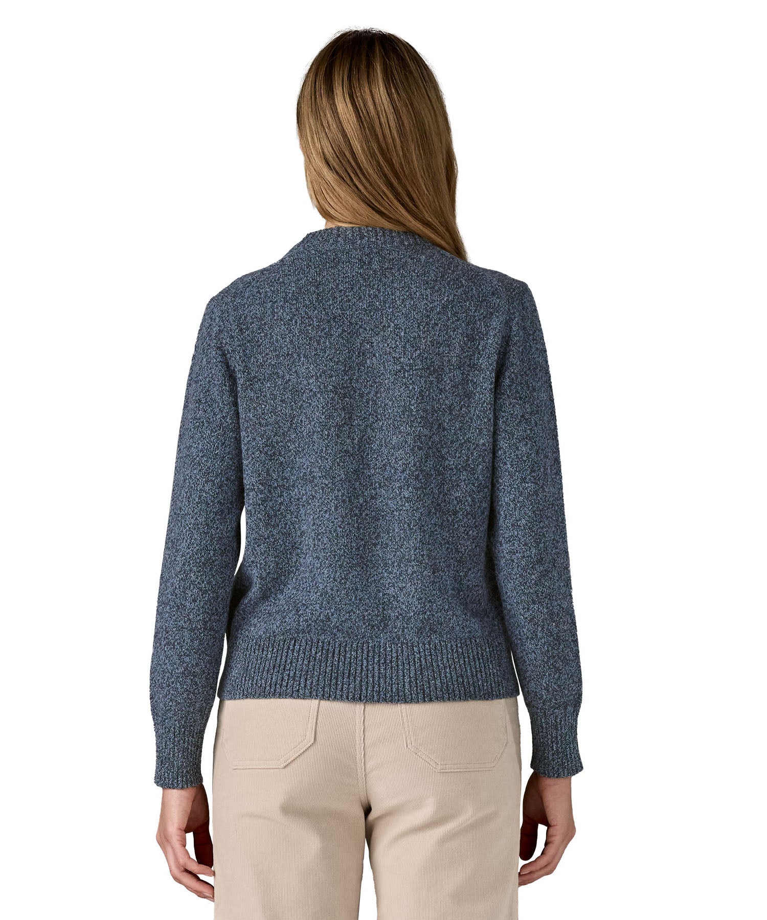 The back of a woman wearing the Patagonia Women's Recycled Wool-Blend Crewneck Sweater in dark blue with dappled design available at Babipur.